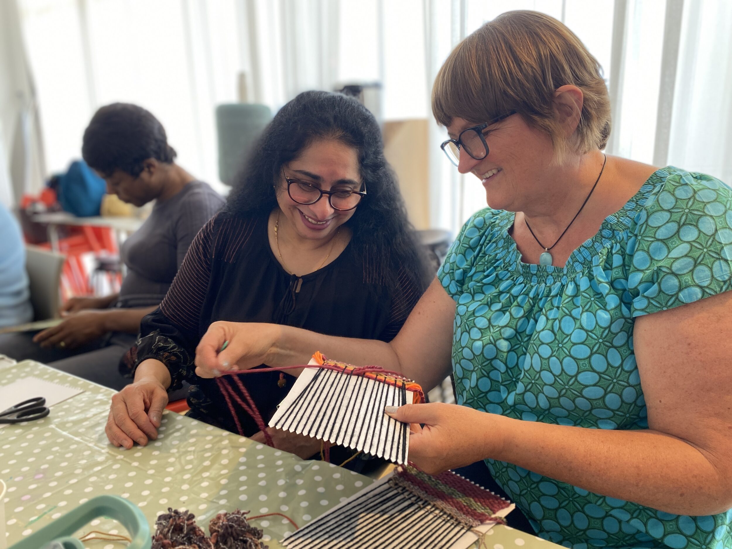Susmitha and Julie enjoy weaving during the Carer's Creative Workshop at the De La Warr Pavilion, 2025